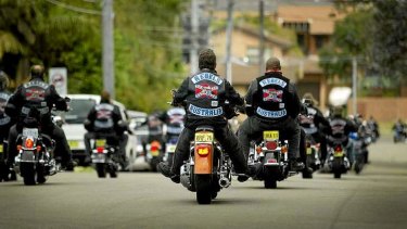 Rebel bikie gang members ride in a group.