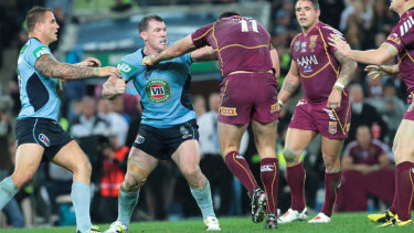 Interstate rivalry: NSW's Paul Gallen and Queensland's Nate Myles sort out their differences.