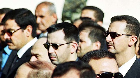 The now-deposed Syrian president Bashar al-Assad (right) and his brother Maher (centre) at the funeral of their father, Hafez al-Assad, in Damascus in 2000.
