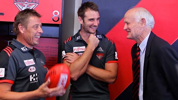 Essendon coach Mark Thompson, captain Jobe Watson and former premiership captain Ken Fraser in 2014.