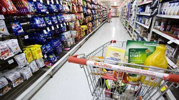 Coles has banned trolleys in some of its self-service checkouts.  