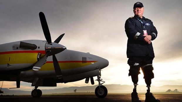 Almost a year after the crash, double amputee pilot Glenn Todhunter was able to walk independently again.