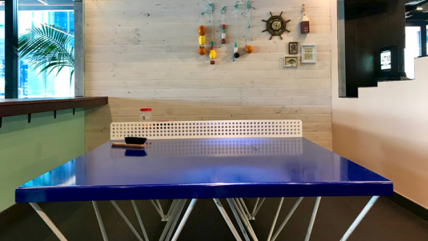 The new tenants have created family-friendly spaces that house ping pong tables and arcade games.