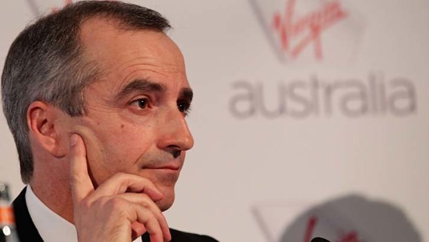  Virgin Australia has booked big writedowns as it clears the decks for John Borghetti's successor.