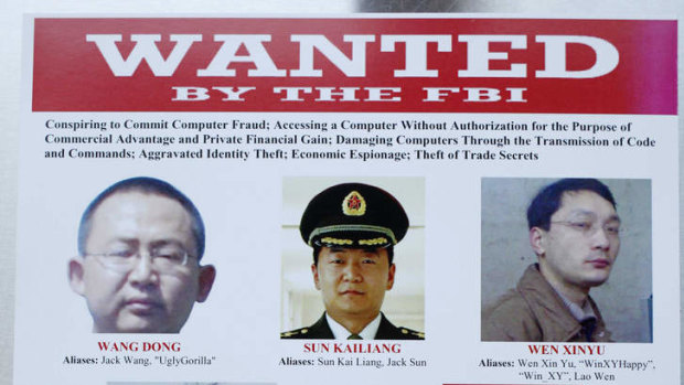 Chinese hackers charged with economic espionage and trade secret theft are shown in a wanted poster.