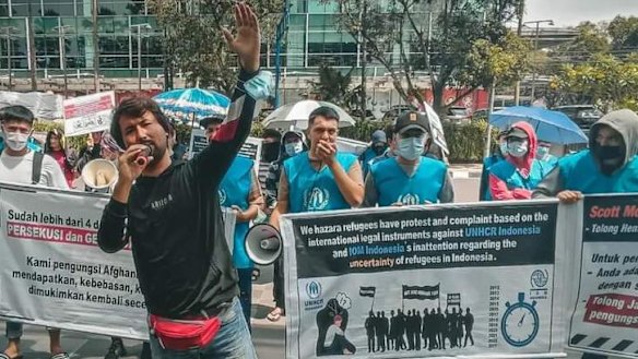 Refugee leader Ezat Ahmadi fronts a peaceful protest in Indonesia.