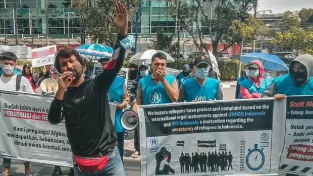 Refugee leader Ezat Ahmadi fronts a peaceful protest in Indonesia.