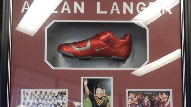 A signed boot from Allan Langer is among the items collected and now catalogued by Ipswich City Council staff.