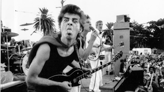 Red Symons, on stage with the Skyhooks, plays the black Les Paul Custom that was stolen from his house decades ago.