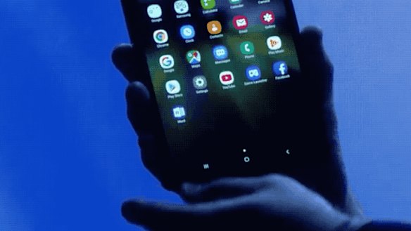 Samsung's folding phone has a small screen on the front, and unfolds to reveal a 7.3-inch screen inside.