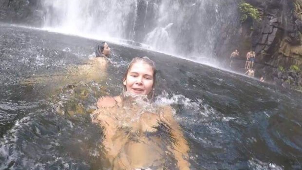 Anneka Bading films herself swimming near MacKenzie Falls, unaware  a man has just slipped into the water. In the background his friend's are frantically trying to rescue him.