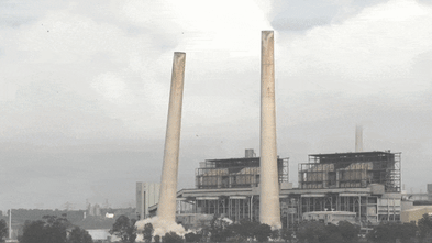 Watch: Liddell power station chimneys come crashing down