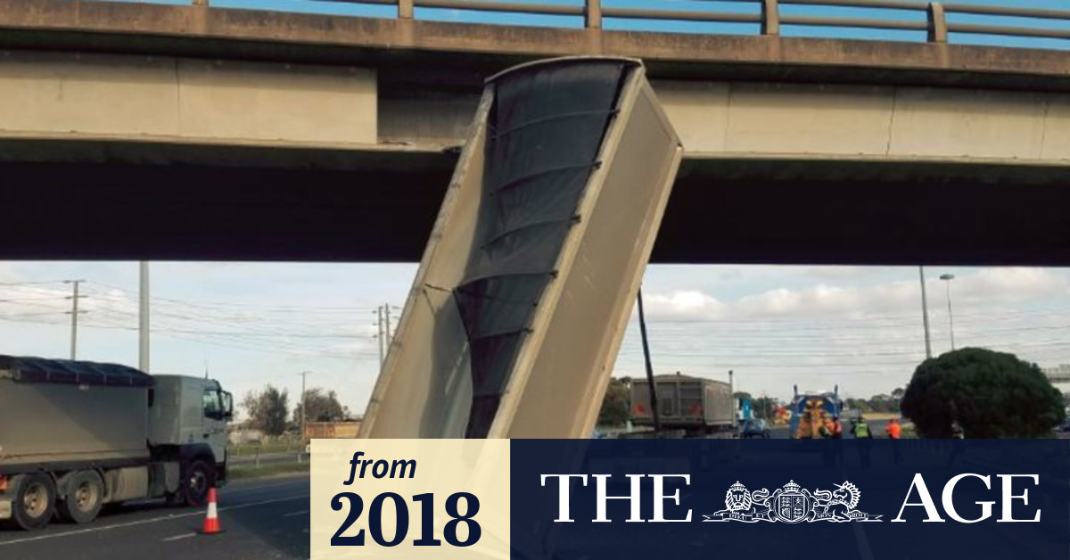Truck comes off second best after driver hits bridge with raised trailer