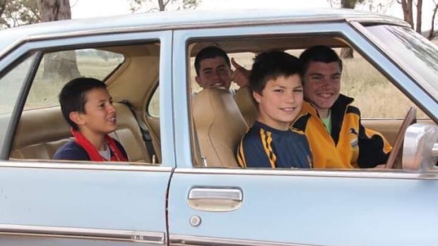 Back in the day: Jack Maddocks in the driver's seat and Angus Crichton next to him in a car on the Young farm where Chrichton grew up.