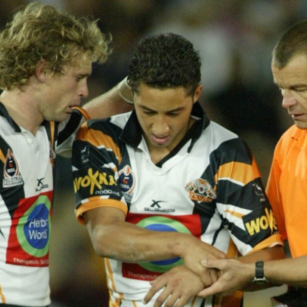 Benji Marshall is taken from the field with a shoulder injury in 2004.
