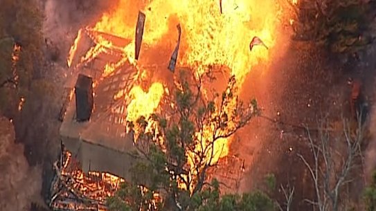 An aerial view of a house exploding in a massive fireball in Tonimbuk in the Bunyip fire. 