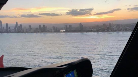 The state government's Rescue 500 helicopter searching off the Gold Coast for a missing jet skier.