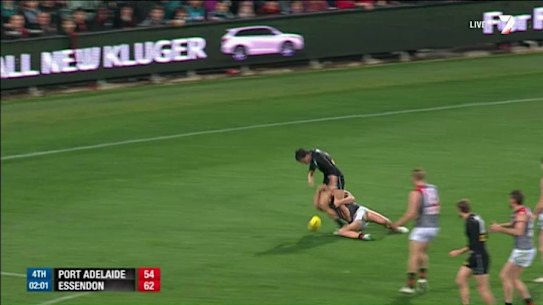 Non-call: Angus Monfries is tackled by Mark Baguley.