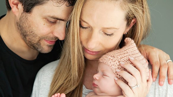 Jonathan and Rachael Casella hold their baby daughter Mackenzie who was diagnosed with SMA and died at seven months.