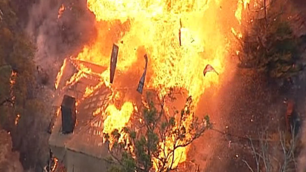 An aerial view of a house exploding in a massive fireball in Tonimbuk in the Bunyip fire. 