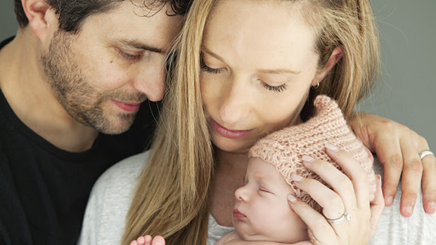 Jonathan and Rachael Casella hold their baby daughter Mackenzie who was diagnosed with SMA and died at seven months.