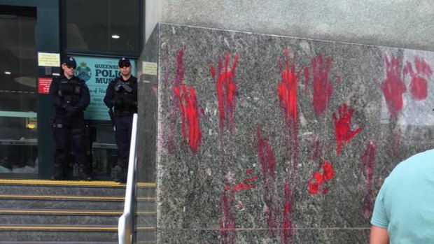 Red handprints were left outside police headquarters in Roma Street, Brisbane, during the Black Lives Matter protest. 