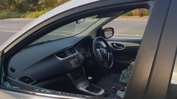 Susan Hallmond's passenger car window was left shattered after a projectile was thrown at it. 