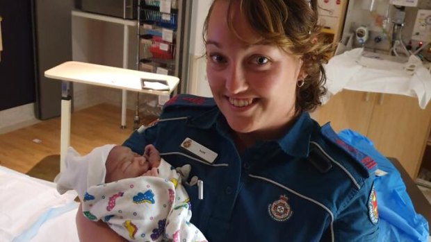 Gold Coast paramedic Samantha with the newborn baby girl on January 1.
