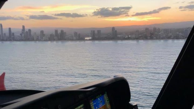 The state government's Rescue 500 helicopter searching off the Gold Coast for a missing jet skier.