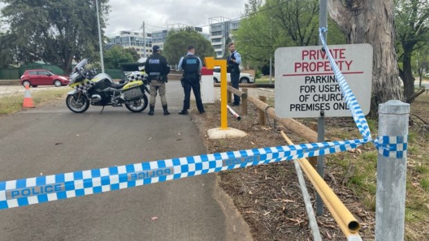 Police seal off a car park in the Canberra suburb of Barton.