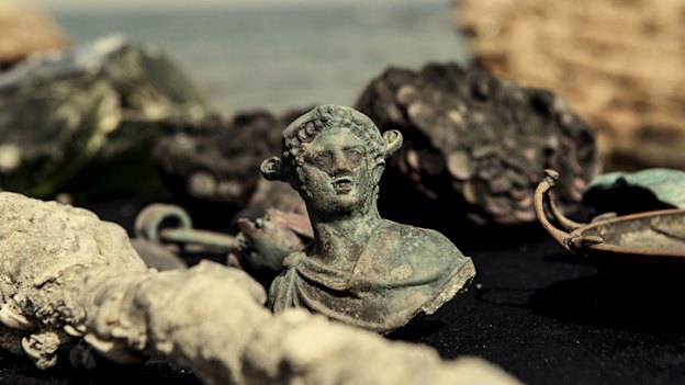 Bronze artefacts from a cargo ship that sank 1600 years ago on show in Caesarea, Israel in 2016.