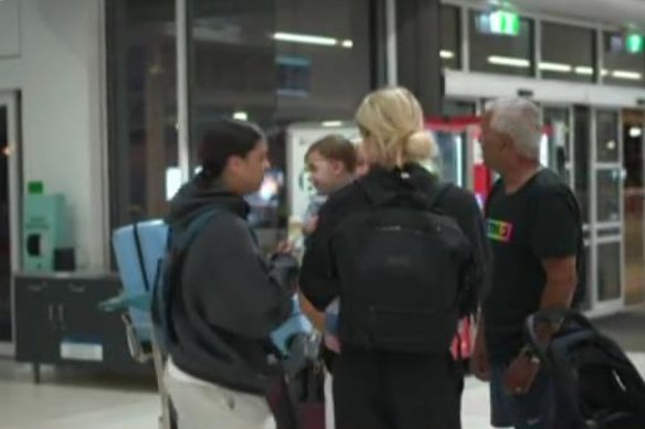 Sam Kerr hugging her son after arriving in Perth ahead of the Asian Cup.