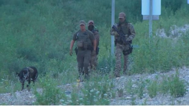 Police officers search for the teens near Gillam, Manitoba.