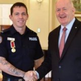Zachary Rolfe with then-Governor-General Peter Cosgrove in early 2019 after the officer’s 2016 river rescue effort.