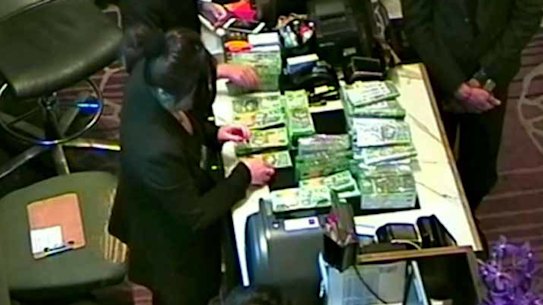 The NSW government inquiry has examined footage leaked to MP Andrew Wilkie showing large amounts of cash being exchanged in one of Crown Melbourne's private gaming rooms.
