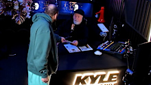 Kyle Sandilands was served with subpoena papers live on air by his manager, Bruno Bouchet. 