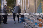 A scuffle between David James Cook, 63, and a photographer outside a Newtown court.