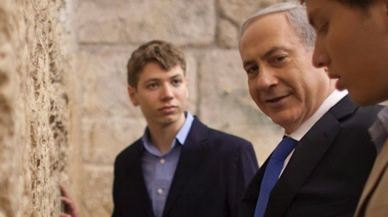  Israeli Prime Minister Benjamin Netanyahu, centre, prays with his sons Yair, background, and Avner, right, at the Western Wall in Jerusalem's Old City in 2013.