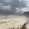 Record dam spill swells Central West flood, as more than 100 people rescued