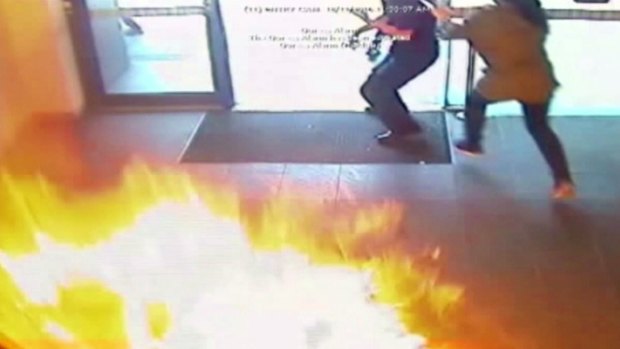 People flee the fireball in the Springvale Commonwealth bank.
