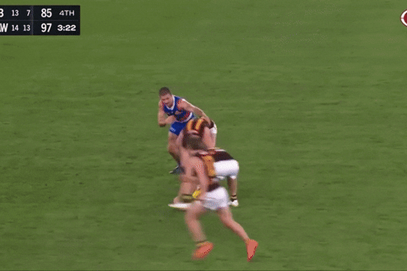 The Western Bulldogs’ Tony Liberatore copped a stray boot to the face against Hawthorn.