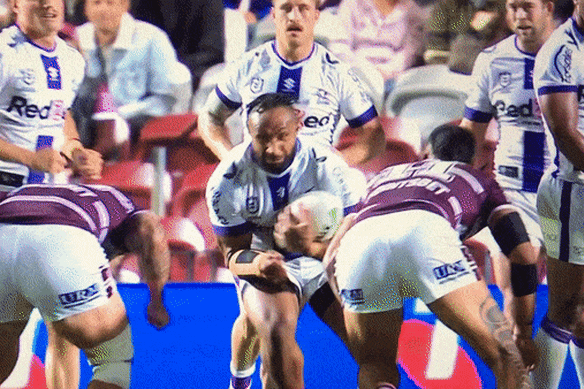 Cop that ... Haumole Olakau’atu and Josh Aloiai flatten Melbourne’s Justin Olam.