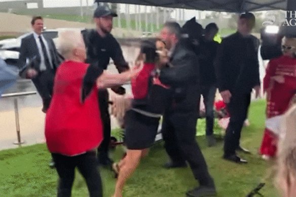 One of Keen-Minshull’s supporters, wearing a red “Let Women Speak” vest appears to grab and pull at Thorpe before the senator fell heavily to the ground.