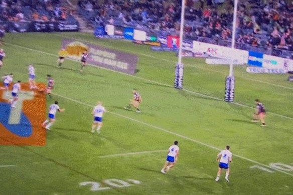 Luke Brooks is shoved in the back by Canberra’s Emre Guler.