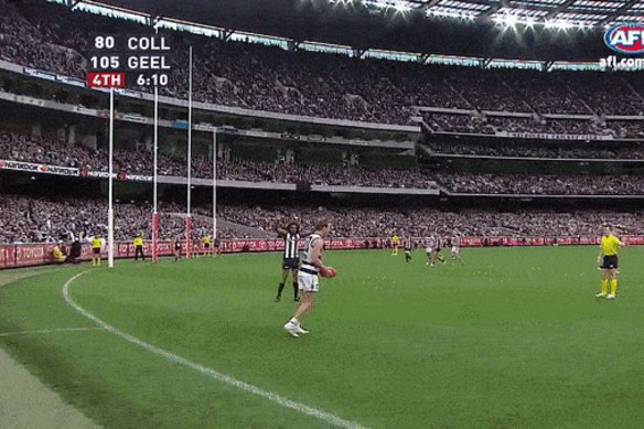 Steve Johnson takes a snap from a set shot against the Pies.