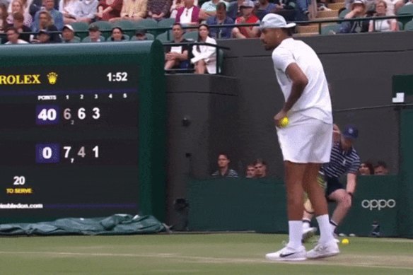 Nick Kyrgios serves underarm at Wimbledon.