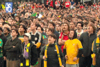 Fans at Federation Square celebrate Connor Metcalfe's goal.