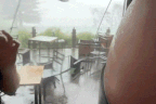 Footage shared on social media showed tables and chairs outside cafés in Ulladulla being swept down the street as winds reached gusts of 100km/h as a mini tornado hit.
