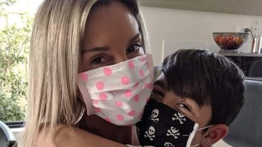 Carina Johnson, with her young son Zak, started making face masks for her family but now sells them online.   