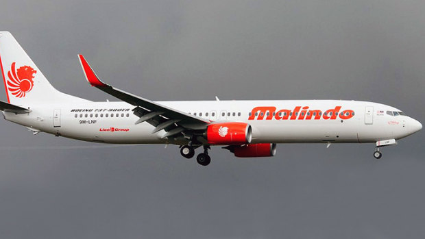 a Victorian woman on board a Malindo Air flight has tested positive for coronavirus.